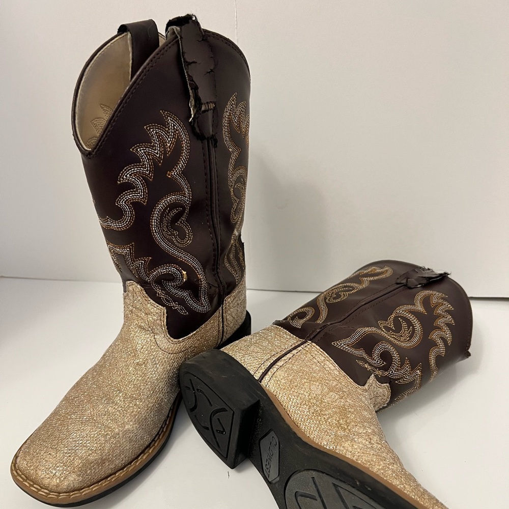 Tan glitter boots with brown tops.